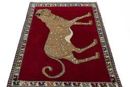 Surface texture of 2000s Persian Gabbeh rug with natural Wool and intricate pattern