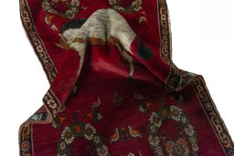 Corner detail of 2000s Persian Gabbeh rug showing border pattern and Wool pile