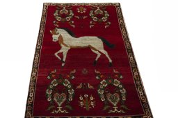 Surface texture of 2000s Persian Gabbeh rug with natural Wool and intricate pattern