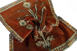 Corner detail of 1970s Persian Gabbeh rug showing border pattern and Wool pile