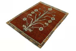 Corner detail of 1970s Persian Gabbeh rug showing border pattern and Wool pile
