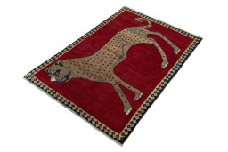 Corner detail of 2000s Persian Gabbeh rug showing border pattern and Wool pile