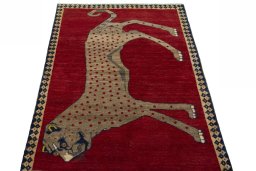 Surface texture of 2000s Persian Gabbeh rug with natural Wool and intricate pattern