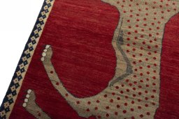 Backside of handmade 2000s Persian Gabbeh rug showing knot structure and weave density