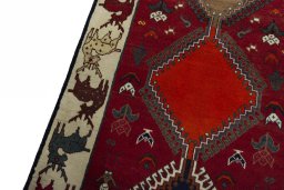 Backside of handmade 2000s Persian Gabbeh rug showing knot structure and weave density