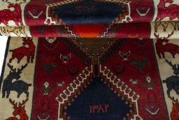 Full view of 2000s Persian Gabbeh rug from Iran / Persia, 256 × 100 cm in Red tones