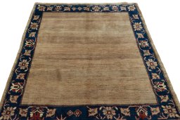 Surface texture of 2000s Persian Gabbeh rug with natural Wool and intricate pattern
