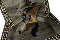 Corner detail of 2000s Persian Gabbeh rug showing border pattern and Wool pile