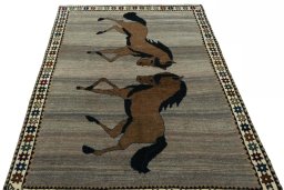 Surface texture of 2000s Persian Gabbeh rug with natural Wool and intricate pattern
