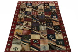 Surface texture of 2000s Persian Gabbeh rug with natural Wool and intricate pattern