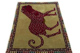 Surface texture of 2000s Persian Gabbeh rug with natural Wool and intricate pattern