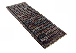 Close-up detail of 2000s Persian Gabbeh rug from Iran / Persia showing Wool weave