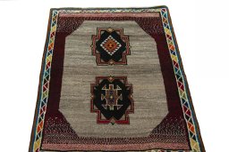 Surface texture of 2000s Persian Gabbeh rug with natural Wool and intricate pattern
