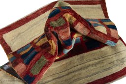 Corner detail of 2000s Persian Gabbeh rug showing border pattern and Wool pile