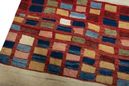 Backside of handmade 2000s Persian Gabbeh rug showing knot structure and weave density