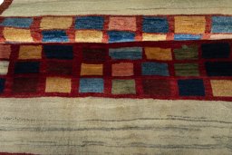 Full view of 2000s Persian Gabbeh rug from Iran / Persia, 117 × 105 cm in Red tones