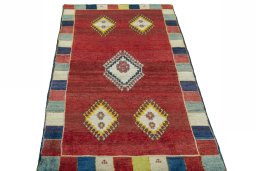 Surface texture of 2000s Persian Gabbeh rug with natural Wool and intricate pattern