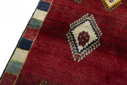 Backside of handmade 2000s Persian Gabbeh rug showing knot structure and weave density