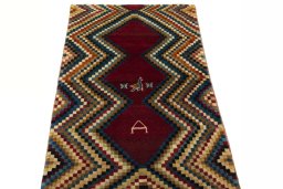 Surface texture of 2000s Persian Gabbeh rug with natural Wool and intricate pattern