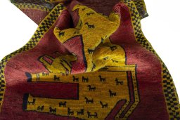 Corner detail of 2000s Persian Gabbeh rug showing border pattern and Wool pile