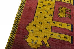 Backside of handmade 2000s Persian Gabbeh rug showing knot structure and weave density