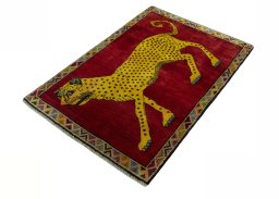 Corner detail of 2000s Persian Gabbeh rug showing border pattern and Wool pile