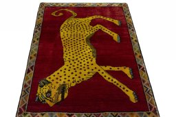 Surface texture of 2000s Persian Gabbeh rug with natural Wool and intricate pattern