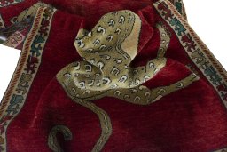 Corner detail of 2000s Persian Gabbeh rug showing border pattern and Wool pile