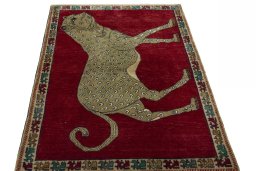 Surface texture of 2000s Persian Gabbeh rug with natural Wool and intricate pattern