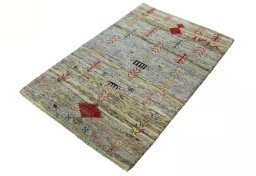 Corner detail of 2000s Persian Gabbeh rug showing border pattern and Wool pile