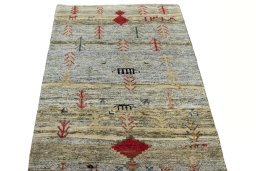 Surface texture of 2000s Persian Gabbeh rug with natural Wool and intricate pattern