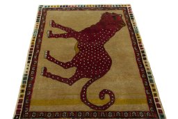Surface texture of 2000s Persian Gabbeh rug with natural Wool and intricate pattern