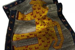 Corner detail of 2000s Persian Gabbeh rug showing border pattern and Wool pile