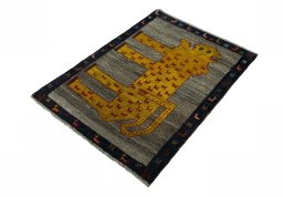 Corner detail of 2000s Persian Gabbeh rug showing border pattern and Wool pile