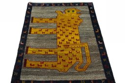 Surface texture of 2000s Persian Gabbeh rug with natural Wool and intricate pattern