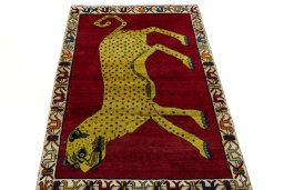 Surface texture of 2000s Persian Gabbeh rug with natural Wool and intricate pattern