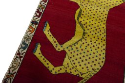 Backside of handmade 2000s Persian Gabbeh rug showing knot structure and weave density