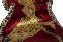 Corner detail of 2000s Persian Gabbeh rug showing border pattern and Wool pile