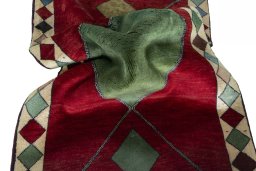 Corner detail of 2000s Persian Gabbeh rug showing border pattern and Wool pile