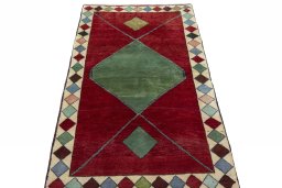 Surface texture of 2000s Persian Gabbeh rug with natural Wool and intricate pattern