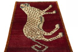 Surface texture of 2000s Persian Gabbeh rug with natural Wool and intricate pattern