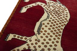 Backside of handmade 2000s Persian Gabbeh rug showing knot structure and weave density