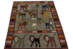 Surface texture of 2000s Persian Gabbeh rug with natural Wool and intricate pattern