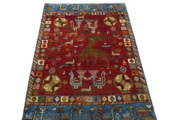 Surface texture of 2000s Persian Gabbeh rug with natural Wool and intricate pattern