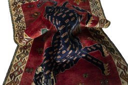 Corner detail of 2000s Persian Gabbeh rug showing border pattern and Wool pile