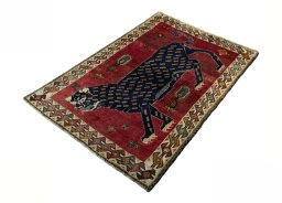 Corner detail of 2000s Persian Gabbeh rug showing border pattern and Wool pile