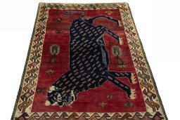 Surface texture of 2000s Persian Gabbeh rug with natural Wool and intricate pattern