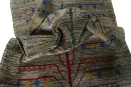 Corner detail of 2000s Persian Gabbeh rug showing border pattern and Wool pile