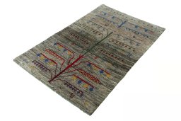 Corner detail of 2000s Persian Gabbeh rug showing border pattern and Wool pile