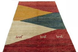 Surface texture of 2000s Persian Gabbeh rug with natural Wool and intricate pattern